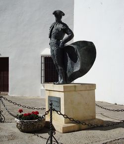 Low angle view of statue against building