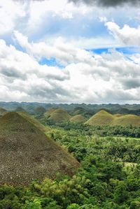 Scenic view of landscape against cloudy sky