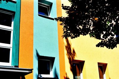 Low angle view of yellow balcony against sky