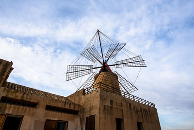 Ancient salt pans with windmill in marsala trapani sicily italy