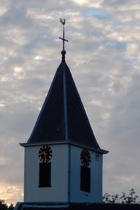 Low angle view of church against cloudy sky