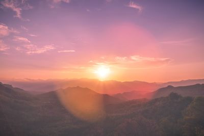 Scenic view of silhouette mountains against sky during sunset