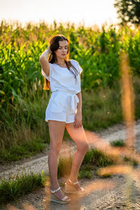 Young woman standing on field