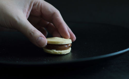 Close-up of hand holding ice cream