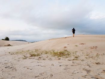 Full length of man on desert against sky