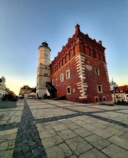 Footpath by building against sky