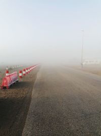 Empty road on land against sky