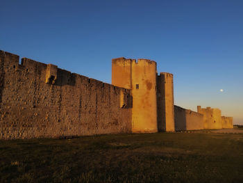 Old ruins against clear blue sky