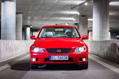 Red vintage car in city