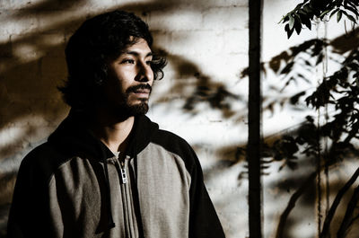 Portrait of young man looking away