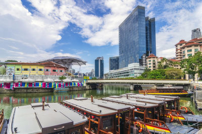 Singapore, singapore city, clarke quay with moored boats in foreground