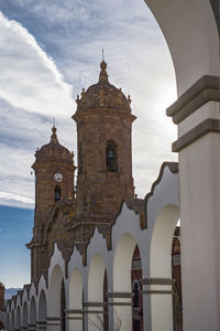 View of church bell tower and clock tower, potosi, bolivia