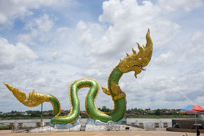 Low angle view of a statue against sky