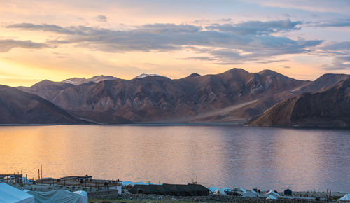 Scenic view of lake against cloudy sky
