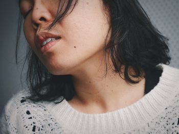 Close-up of young woman with eyes closed