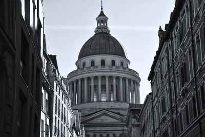 Low angle view of buildings against sky in city