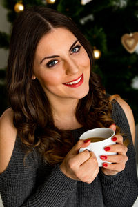 Portrait of a woman drinking coffee