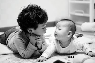 Boy playing with brother at home