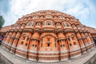 Low angle view of ornate building against sky