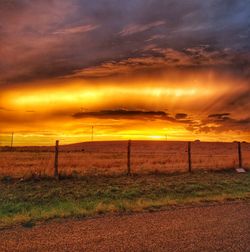 Scenic view of field against sky during sunset