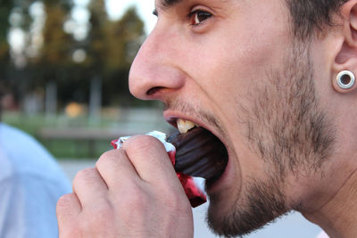 Close-up of man eating food