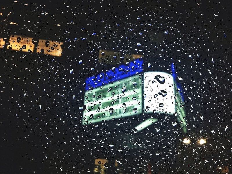 night, car, illuminated, indoors, transportation, land vehicle, wet, window, no people, rain, street, dark, mode of transport, road, drop, glass - material, high angle view, building exterior, full frame, city