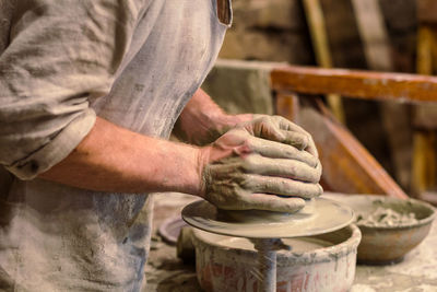 Close up pottery wheel lesson concept photo