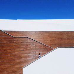 Woman on steps during sunny day