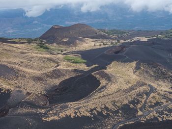 Aerial view of volcanic landscape against sky