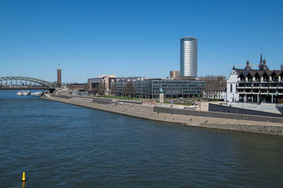 Bridge over river with buildings in background