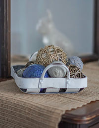 Close-up of wicker basket on table at home