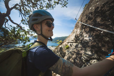 Female rock climber looking away