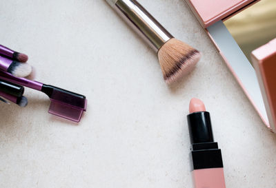 High angle view of make-up on table