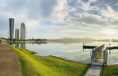 Scenic view of lake against cloudy sky