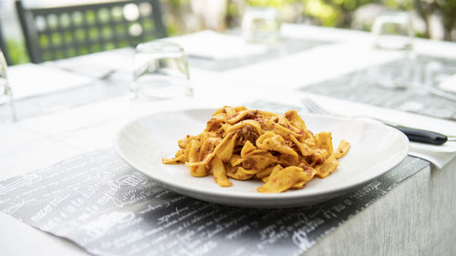 Plate of homemade tagliatelle with ragù. italian food. restaurant.