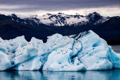 Scenic view of snowcapped mountains against sky