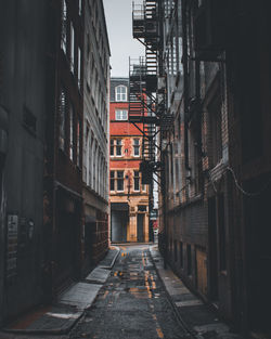 Alley amidst buildings in city