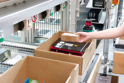 Man holding box to scan check