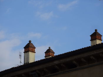 Low angle view of built structure against blue sky