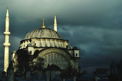 Low angle view of church against cloudy sky