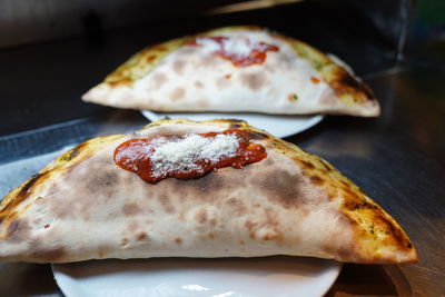 High angle view of pizza in plate on table