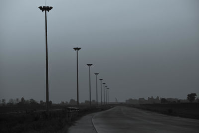 Street lights against sky during winter