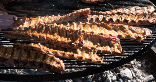 High angle view of meat on barbecue grill