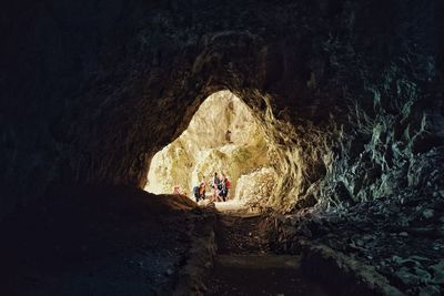 People walking in cave