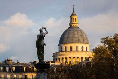 Low angle view of statue of building against sky