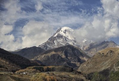 Scenic view of snowcapped mountains against sky