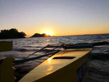 Scenic view of sea against clear sky during sunset