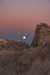 Scenic view of rock formation against clear sky during sunset