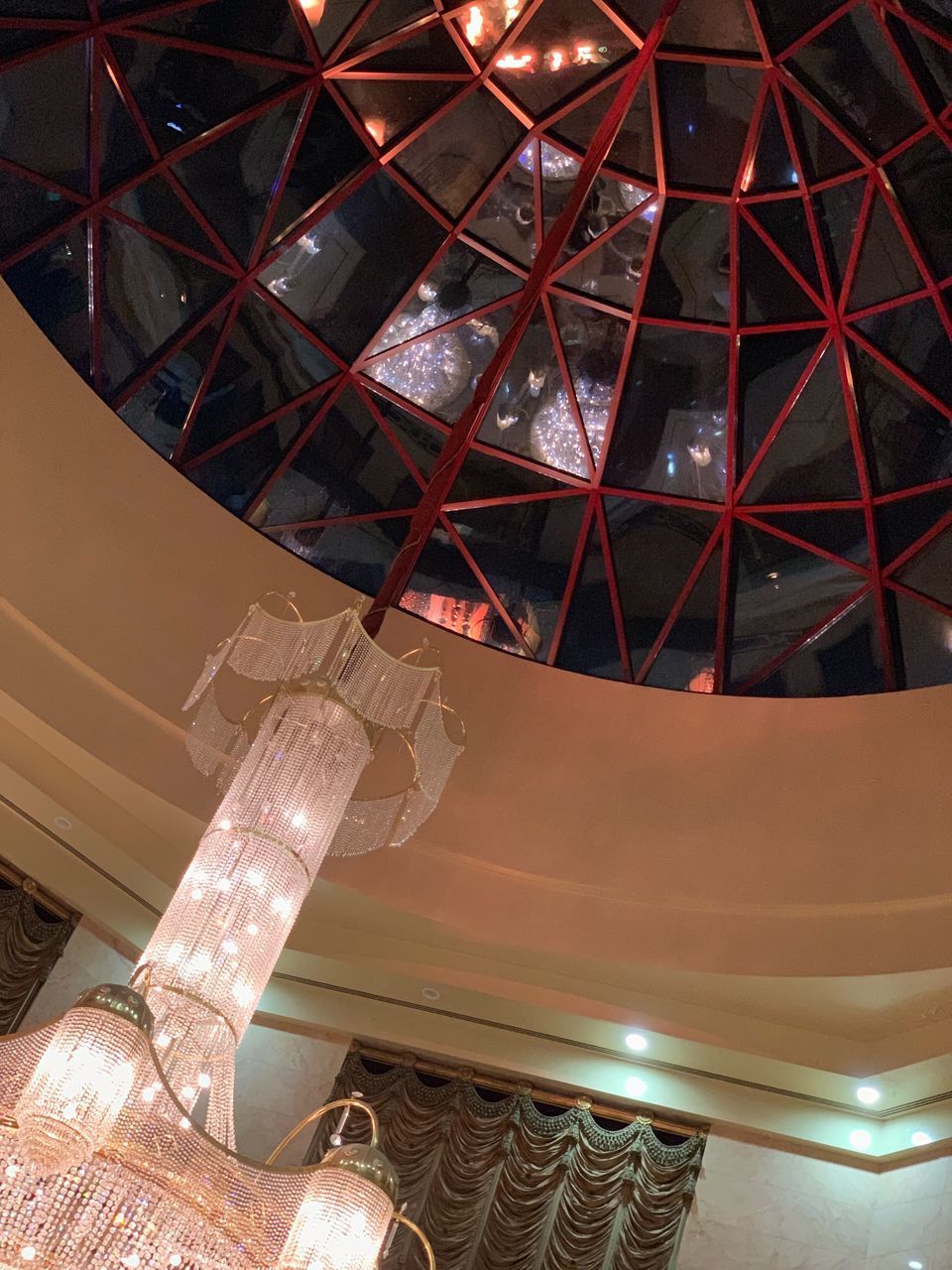 LOW ANGLE VIEW OF ILLUMINATED SPIRAL STAIRCASE