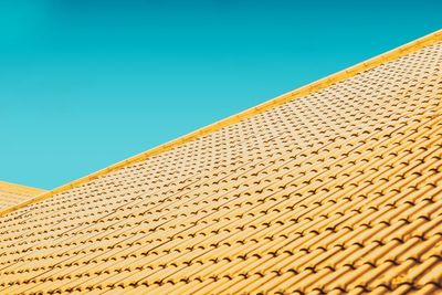 Low angle view of building against clear blue sky